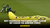 Wtf? Verdwaalde parachutist landt plots in het stadion van München (VIDEO)